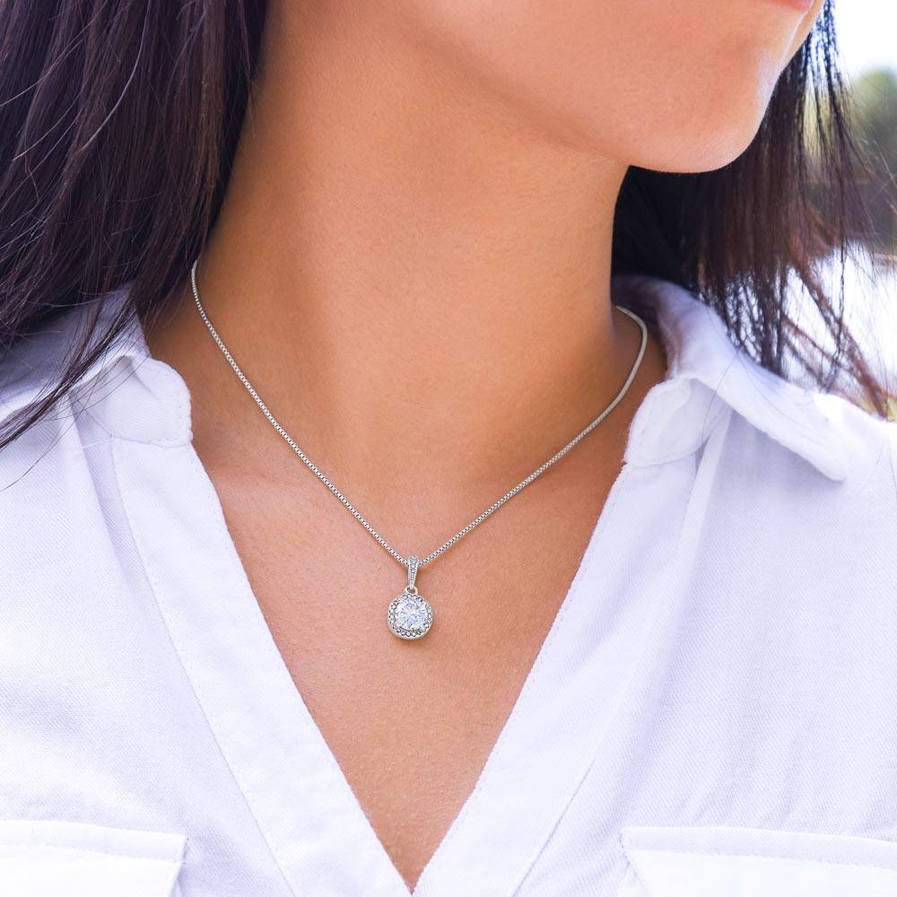 Silver-tone round halo pendant necklace on the collarbone with link chain