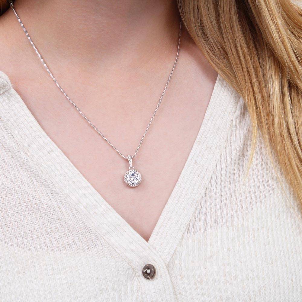 Silver-tone pendant necklace with round halo cubic zirconia charm on a fine chain