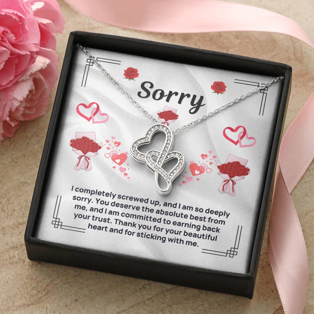 Heart pendant necklace in silver tone, shown in black gift box with card