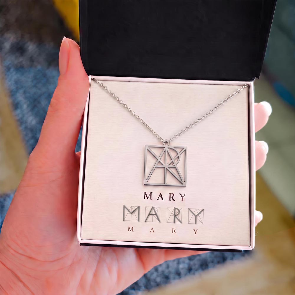Personalized name monogram necklace with silver-tone pendant in jewelry box
