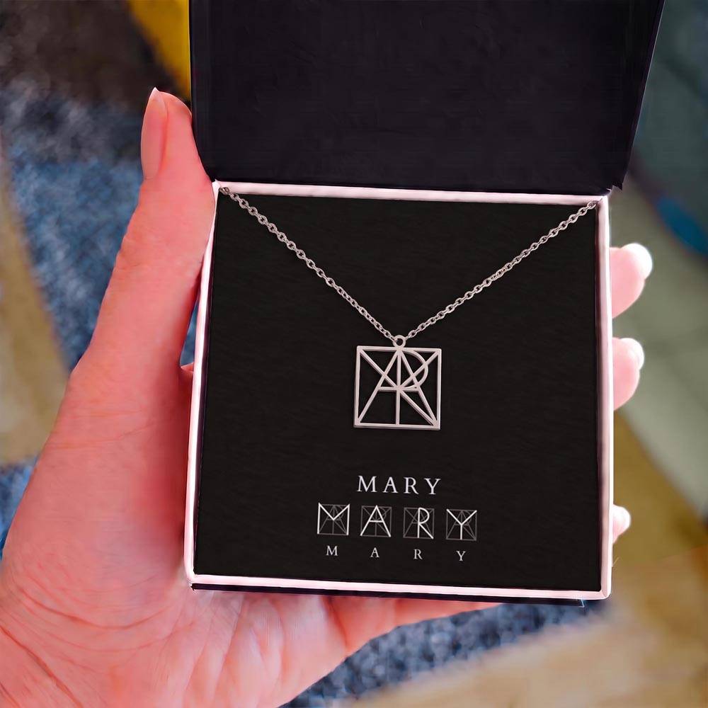 Personalized name monogram necklace with silver-tone pendant in dark jewelry box
