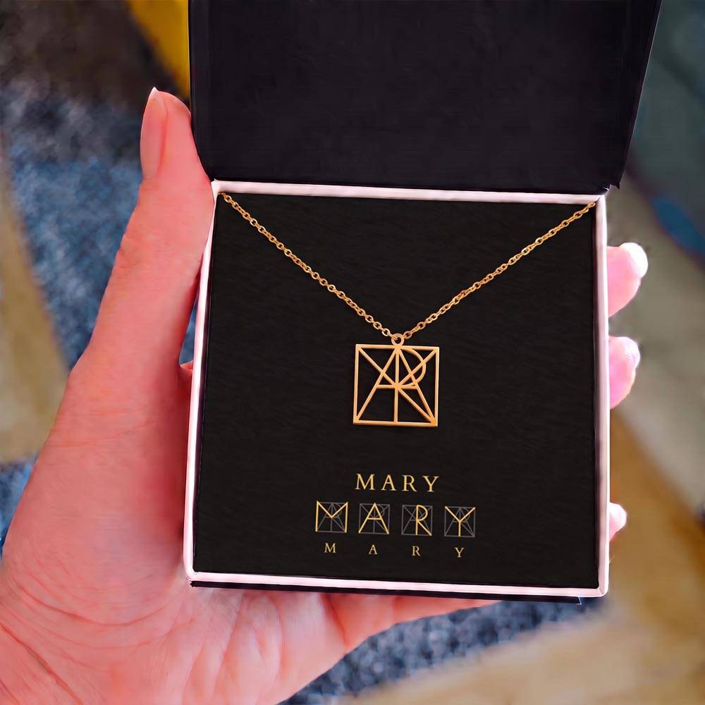 Personalized name monogram necklace with gold-tone pendant in dark jewelry box