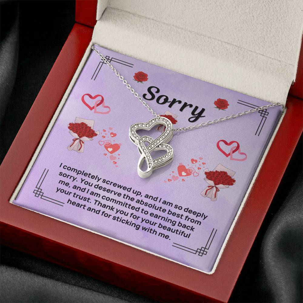 Purple apology card necklace displayed in red gift box, heart pendant on chain
