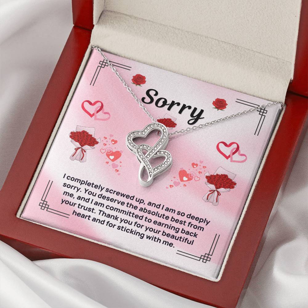 Heart pendant necklace in open red gift box, silver-tone chain and double heart pendant