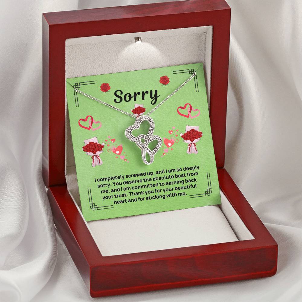 Heart infinity pendant necklace with green card insert, displayed in a red gift box