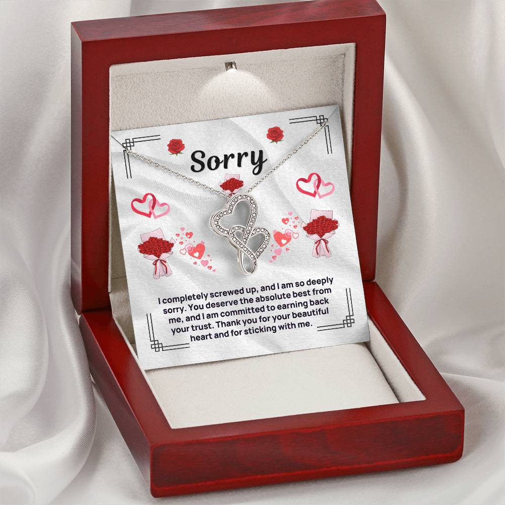 Heart pendant necklace in silver tone, displayed in red gift box with card
