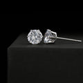 Silver-tone stud earrings with round and marquise cubic zirconia stones, secure backs.