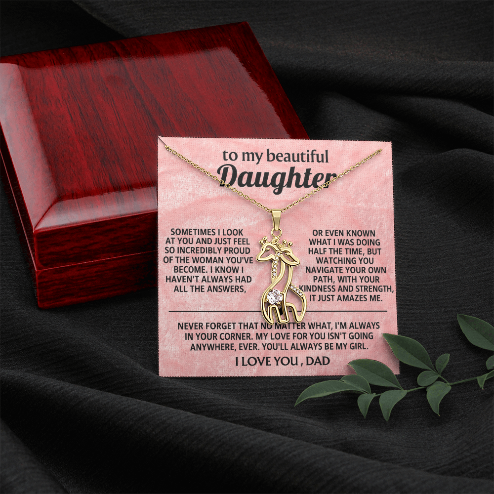 Necklace in dark gift box with silver-toned giraffe pendant and message card