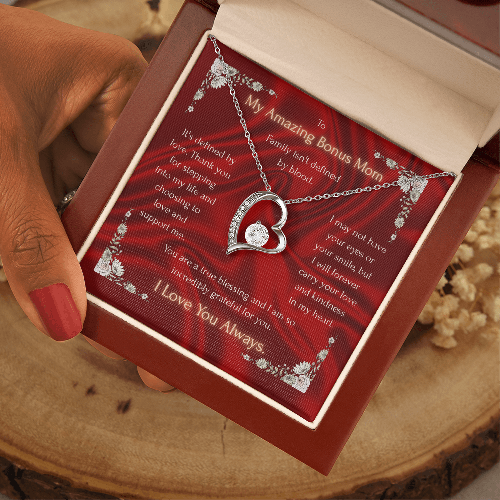 Red gift box with gold-tone heart pendant necklace and chain, heart charm with crystal