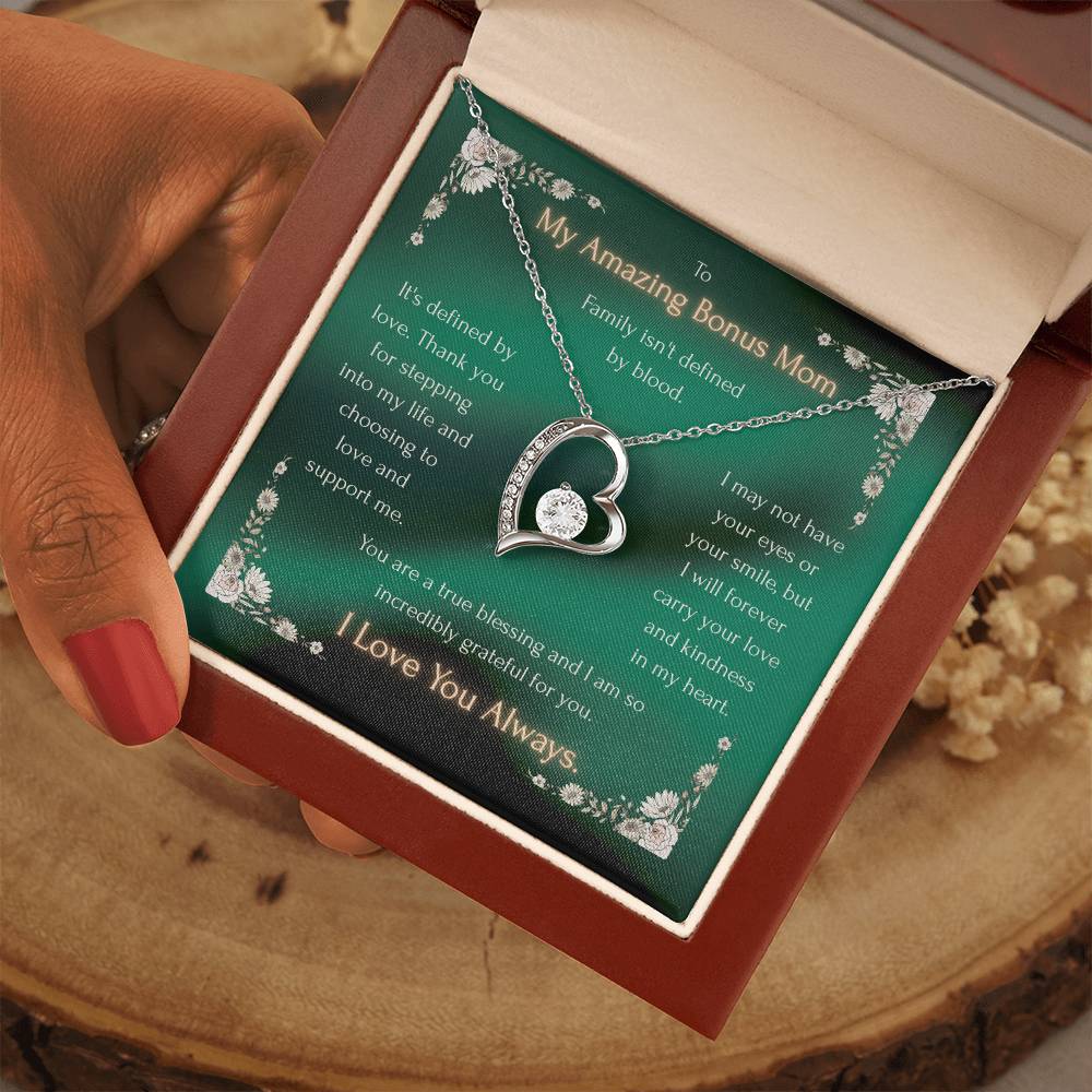 Heart pendant necklace displayed in a gift box with a green message card and chain