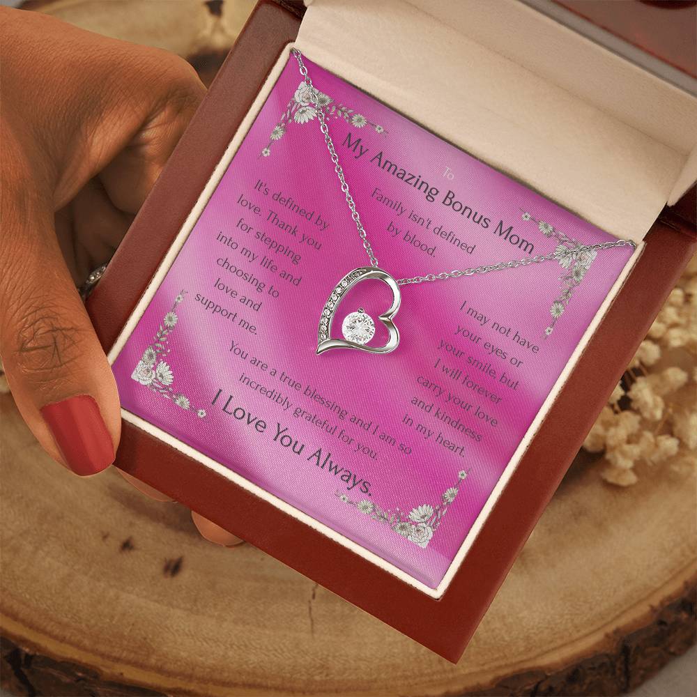 Gold-tone heart pendant necklace with round CZ on pink gift card inside box