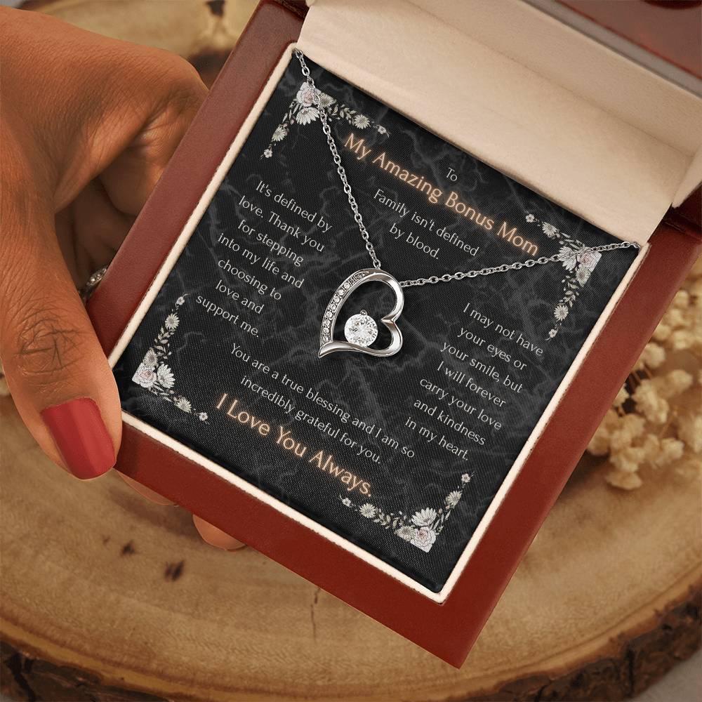 Heart pendant necklace in gift box with black floral message card and silver-tone chain
