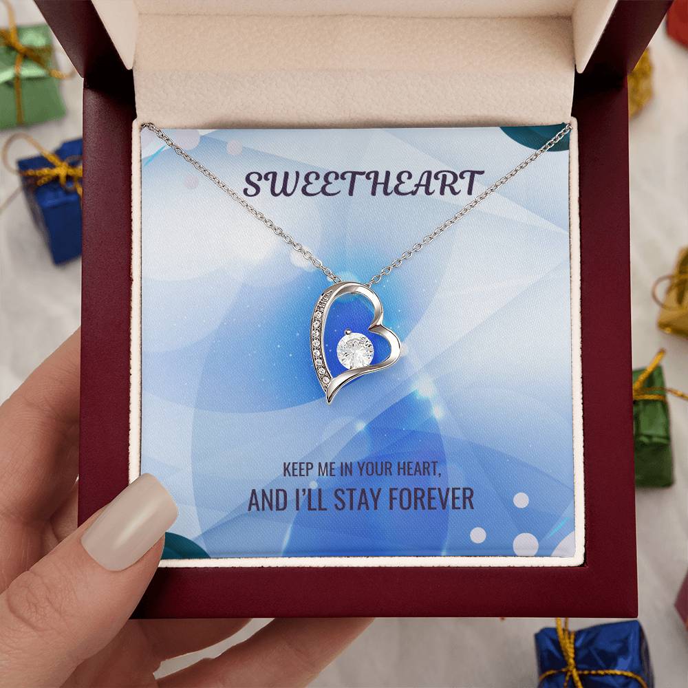 Silver-tone heart pendant necklace in gift box, clear center stone, sparkling border