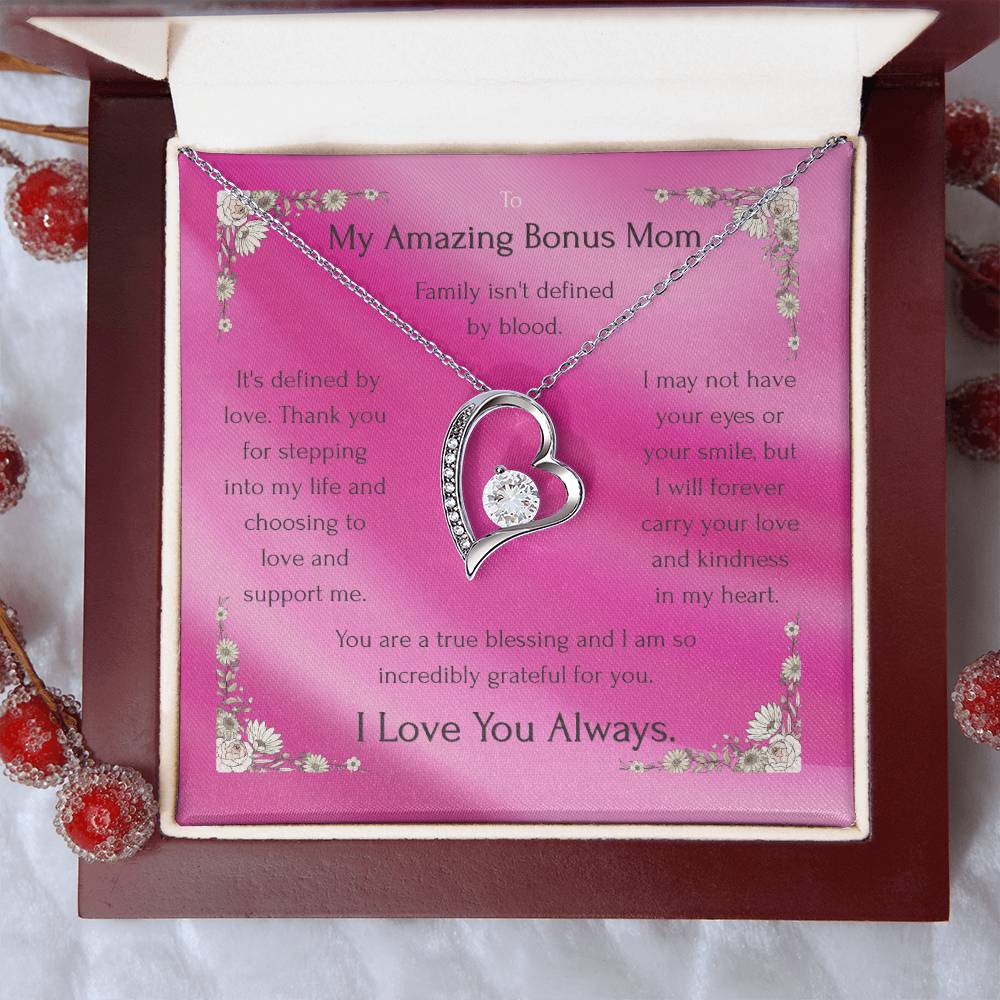 Silver heart pendant necklace on pink message card inside white-and-burgundy gift box