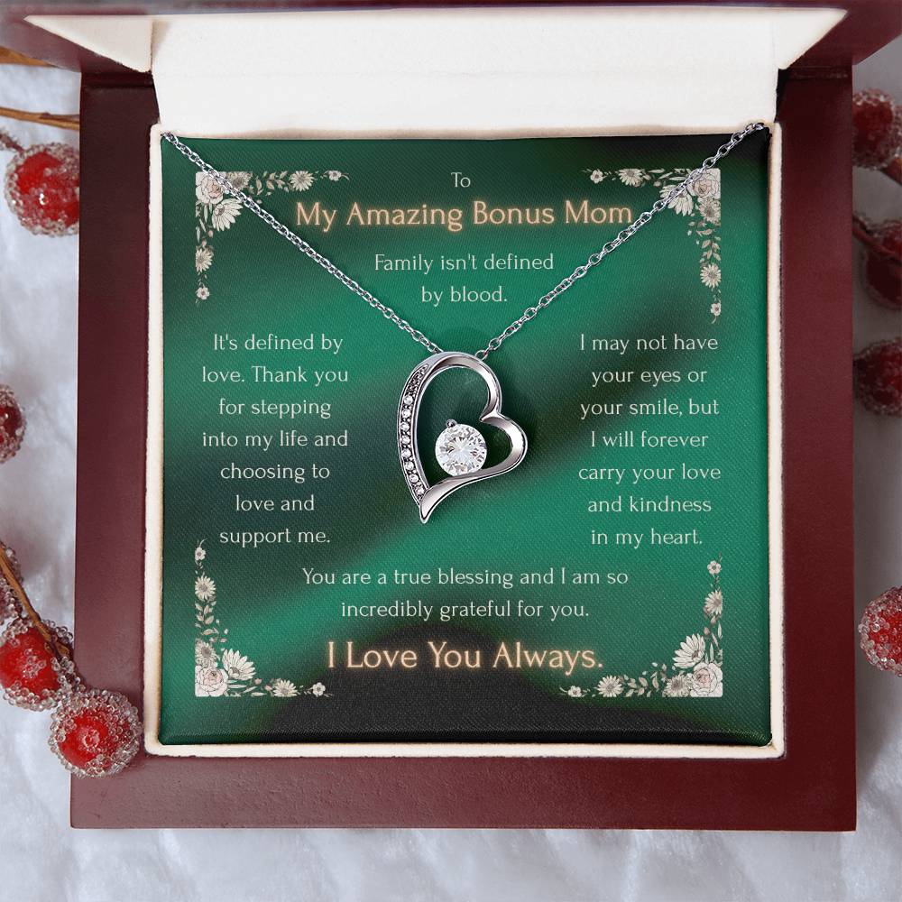 Silver heart pendant necklace with crystal accents, presented inside a gift box