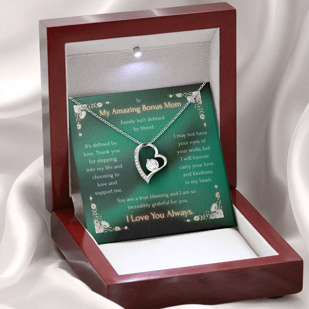 Heart pendant necklace in a gift box with green message card, shown open
