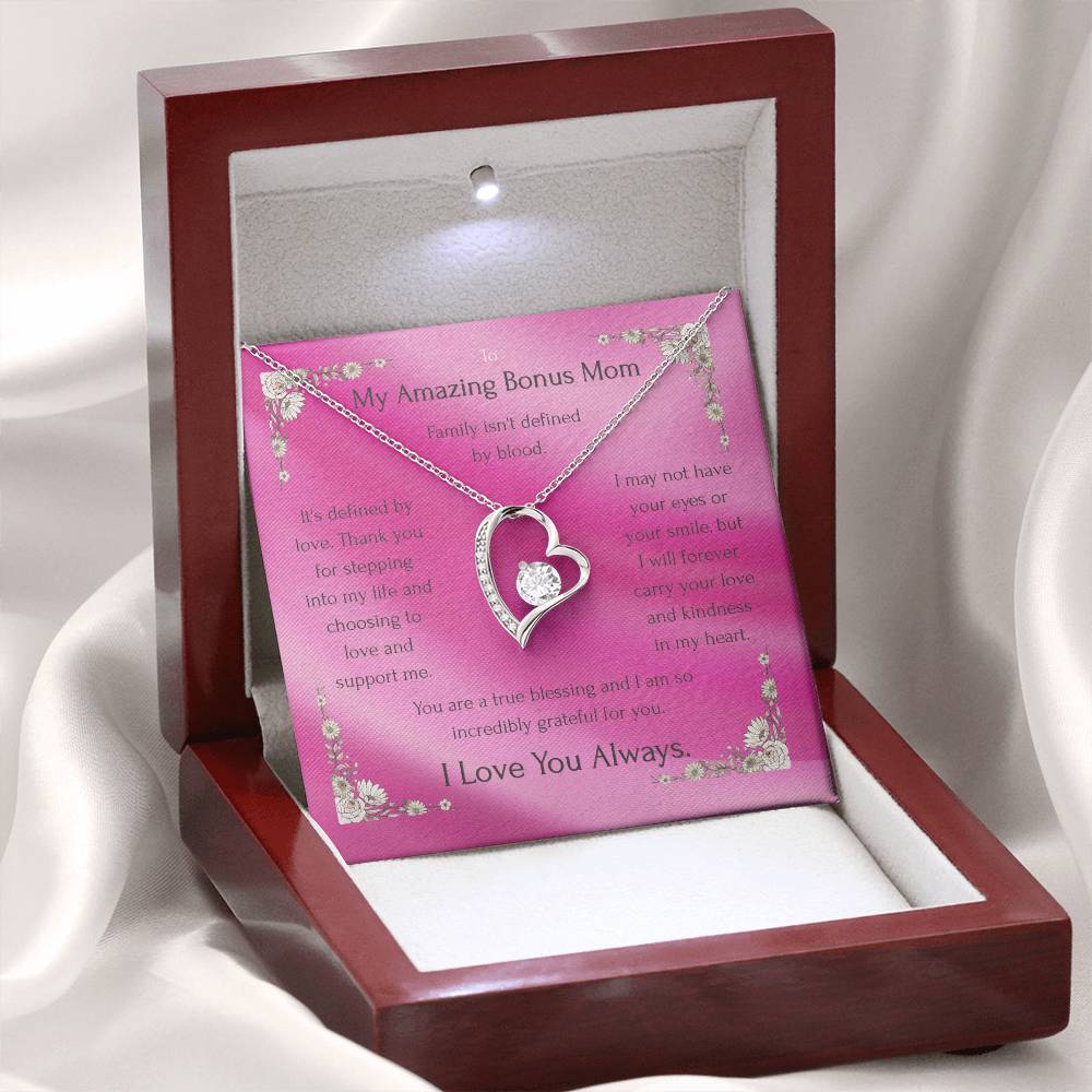Heart charm necklace with round CZ displayed in pink card gift box