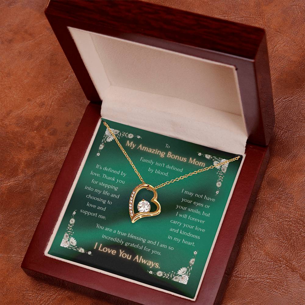 Gold heart pendant necklace with crystal accents, in a gift box with lid open