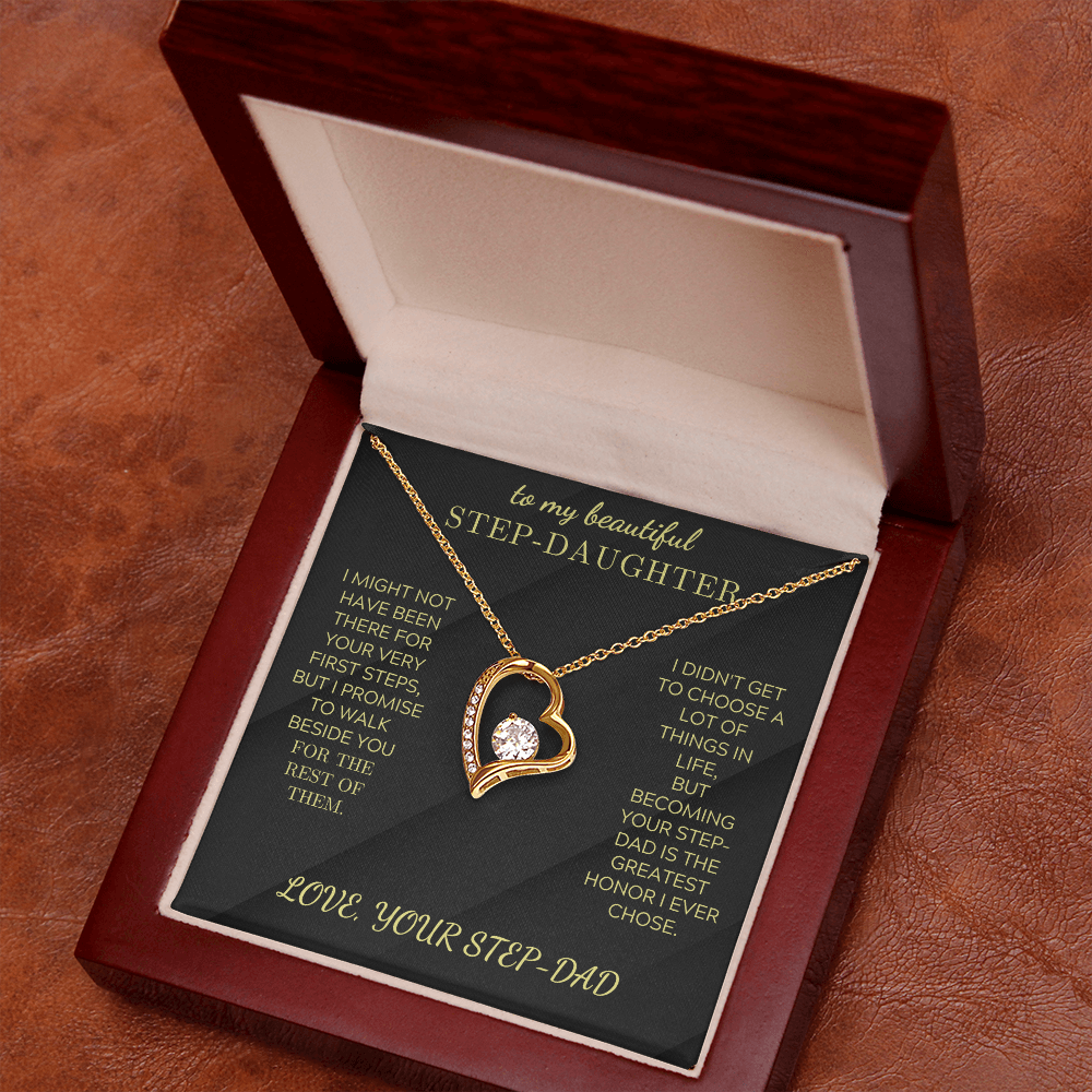 Gold-tone heart pendant necklace with round crystal in open gift box