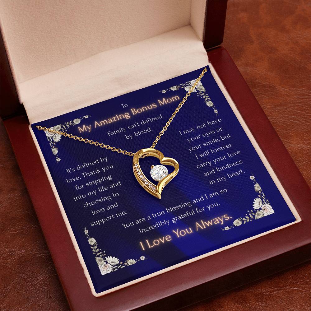 Blue heart pendant necklace in a red gift box, gold-toned heart with crystal details