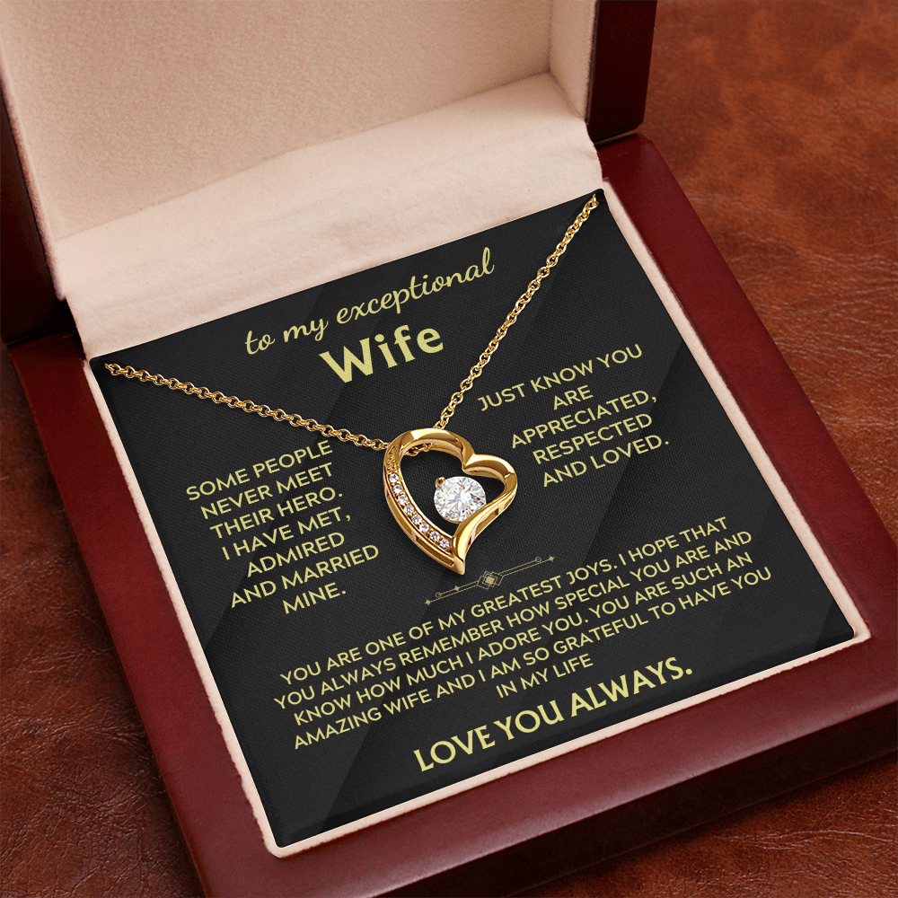 Necklace in gift box with gold heart pendant and chain over black insert