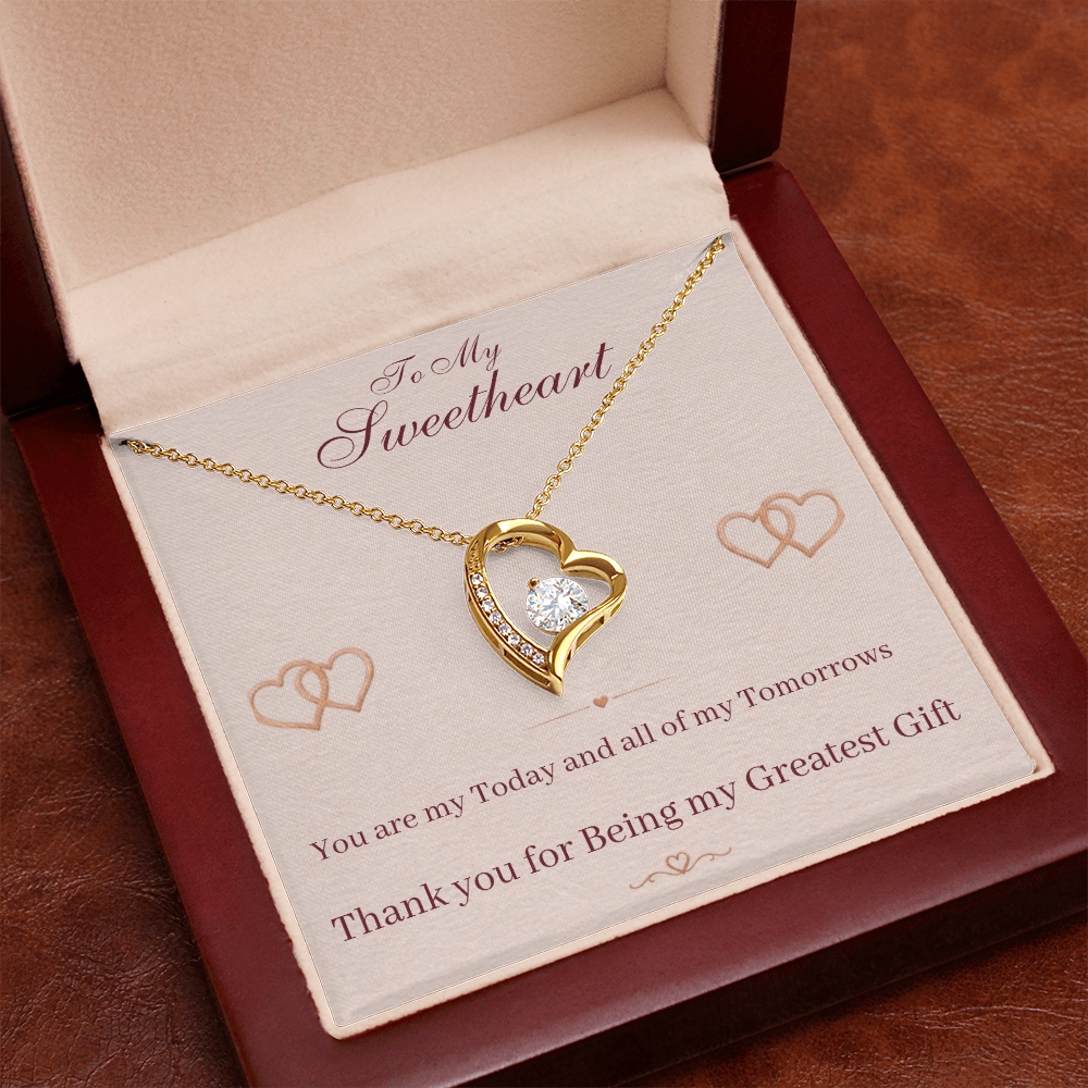 Gold heart pendant necklace in gift box with sweetheart message card on inner tray