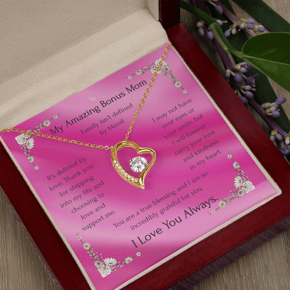 Gold-tone heart pendant necklace with round CZ on pink card in red jewelry box