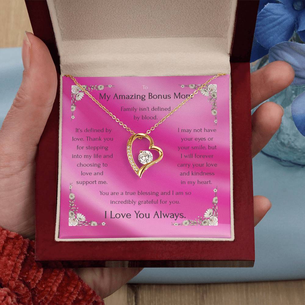 Gold-tone heart pendant necklace with round CZ, shown in pink gift box