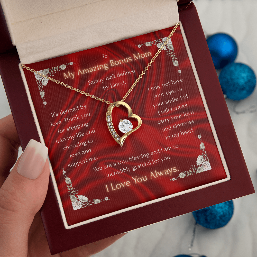 Heart pendant necklace in a red gift box, held in a hand
