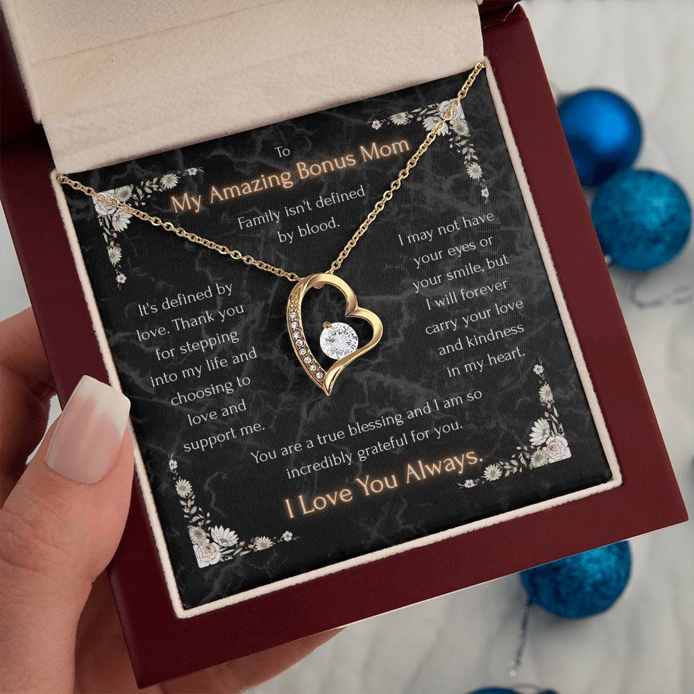 Heart pendant necklace in maroon gift box with black message card and gold-tone chain
