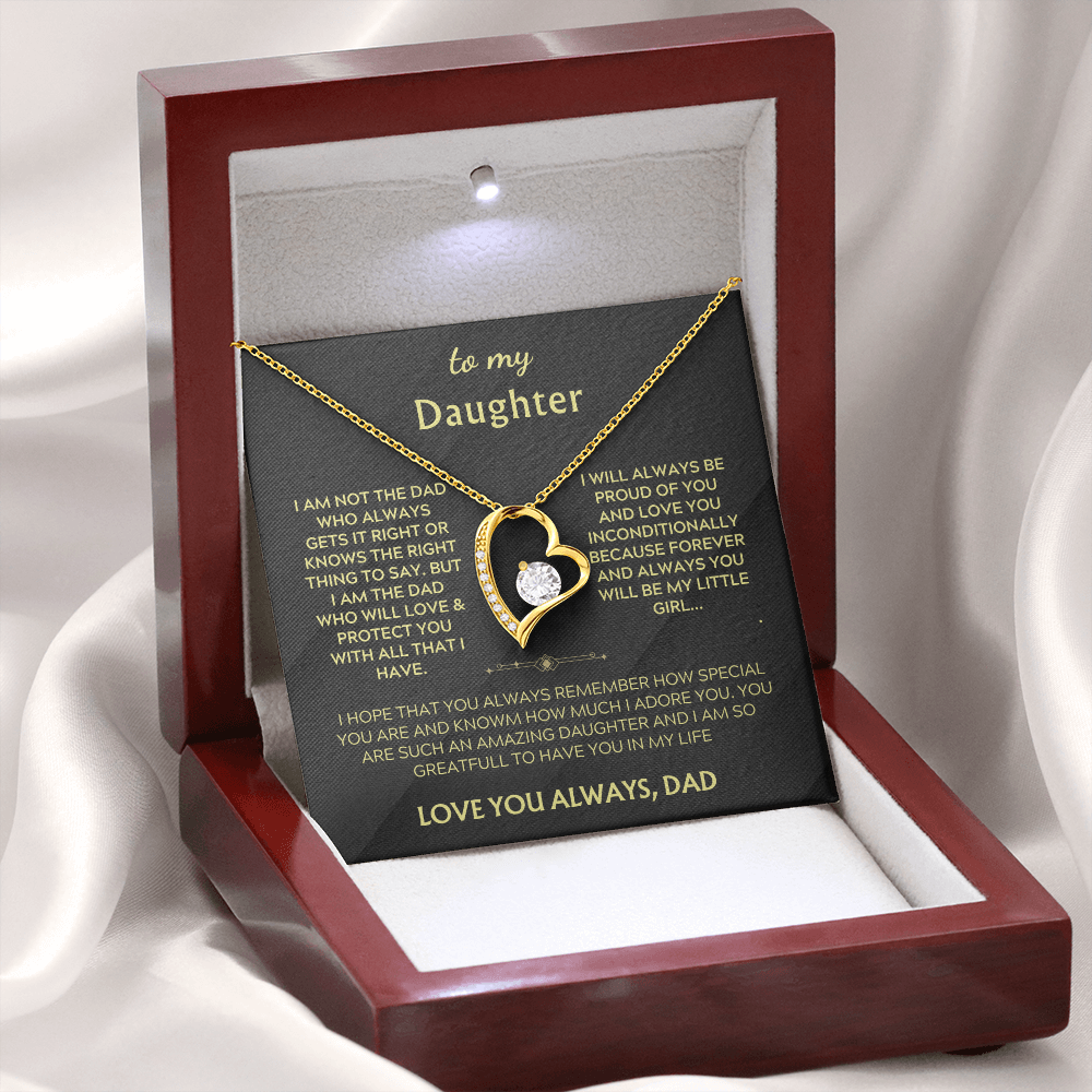 Heart pendant necklace on chain in open red gift box with black card and gold text