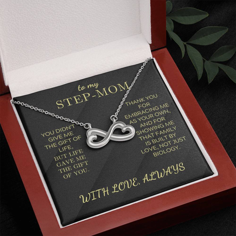 Gift box with black card showing “STEP-MOM” and “WITH LOVE, ALWAYS,” silver necklace
