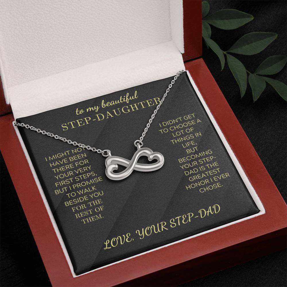 Silver heart-infinity pendant necklace on black insert inside red gift box
