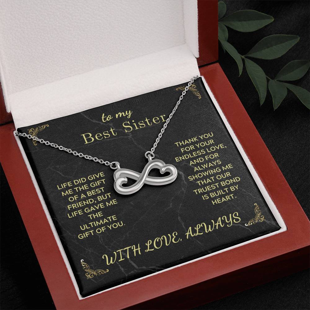 Infinity heart necklace with silver-tone chain in open red gift box