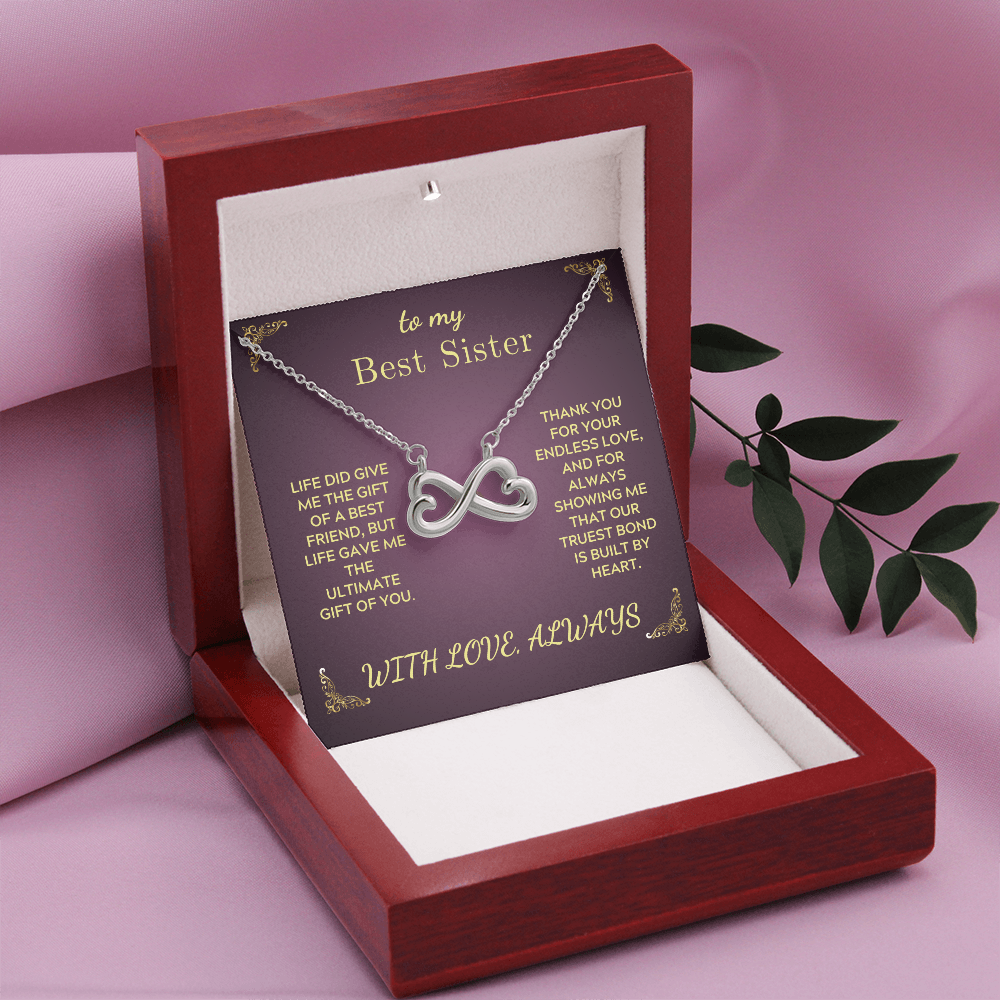 Infinity heart pendant necklace on purple gift card inside red wooden gift box