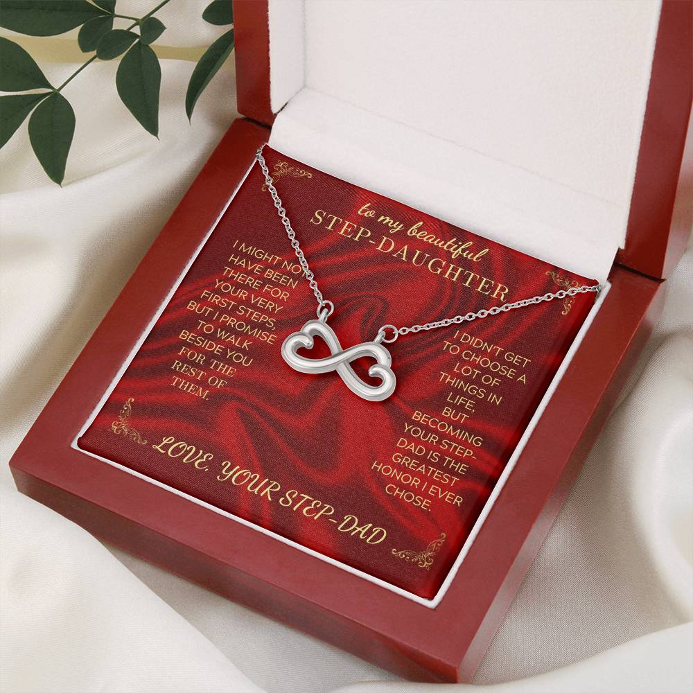 Silver heart-infinity necklace displayed on a red card in an open gift box