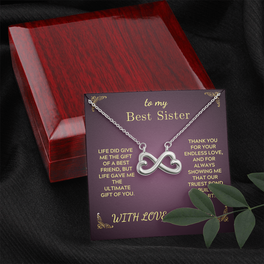 Infinity heart pendant necklace on purple gift card inside dark red wooden box