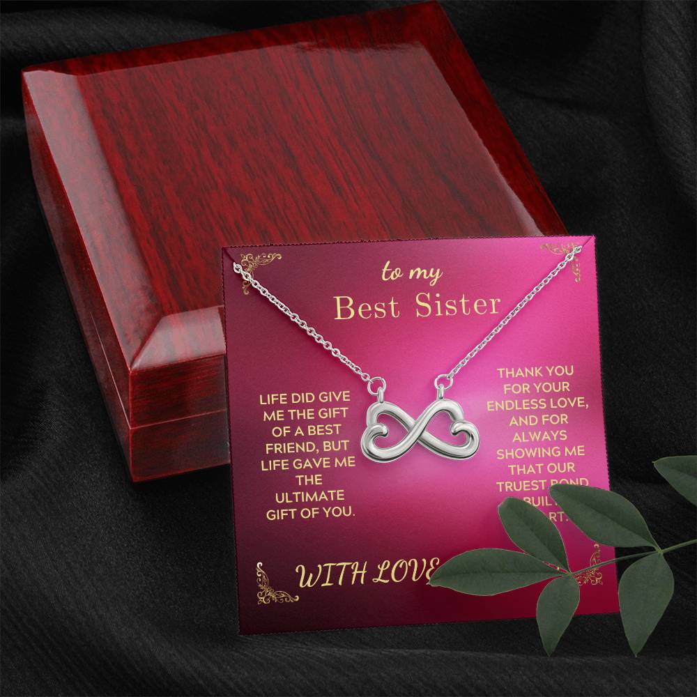 Infinity-heart necklace with pendant in open red gift box