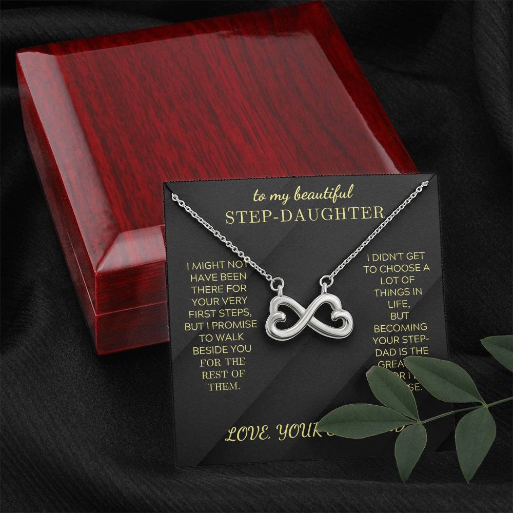 Silver infinity heart pendant necklace on black velvet card and open red box