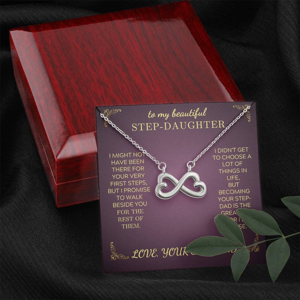 Silver infinity heart pendant necklace with chain over purple gift card