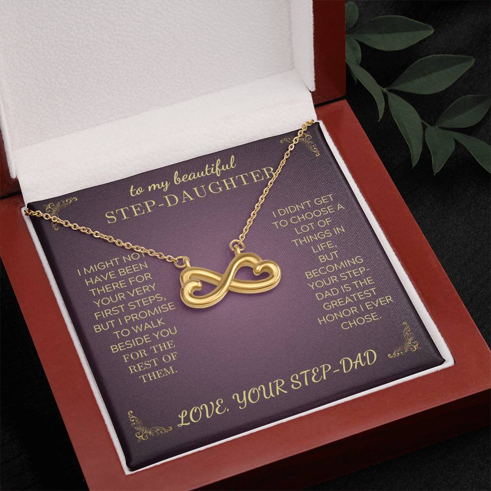 Gold-tone infinity heart pendant necklace displayed in purple gift box with chain