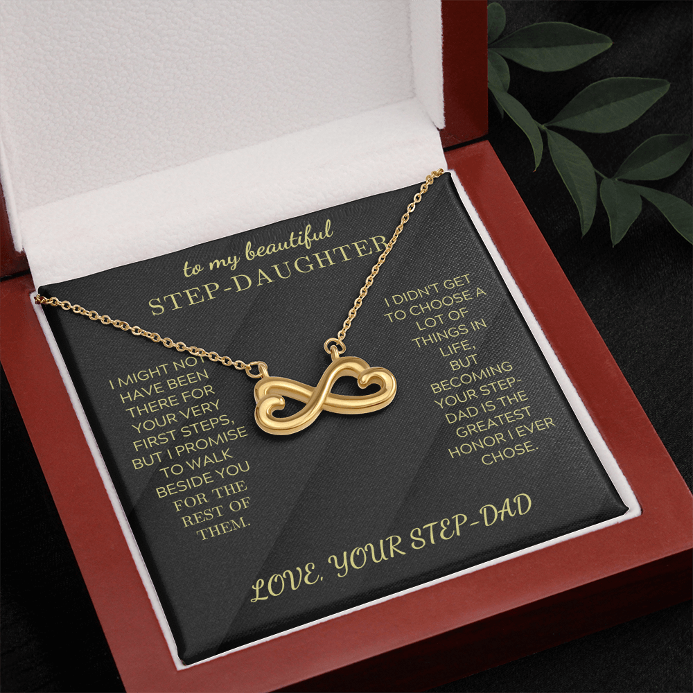 Gold heart-infinity pendant necklace on black insert inside red gift box
