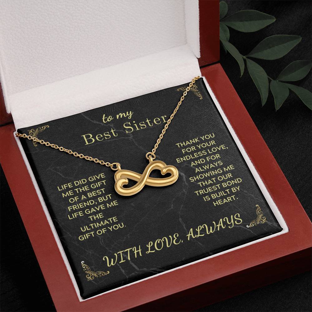 Infinity heart necklace with gold-tone chain in open red gift box