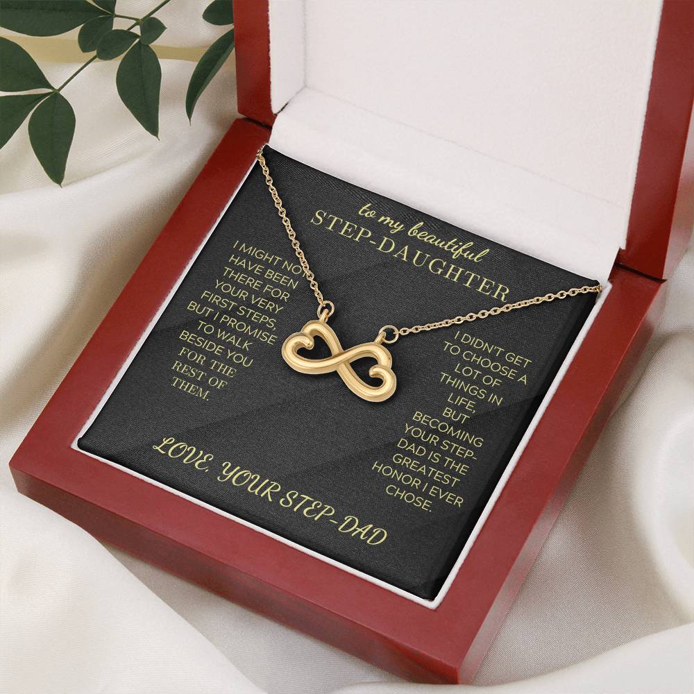 Gold infinity heart pendant necklace on black velvet card inside open gift box