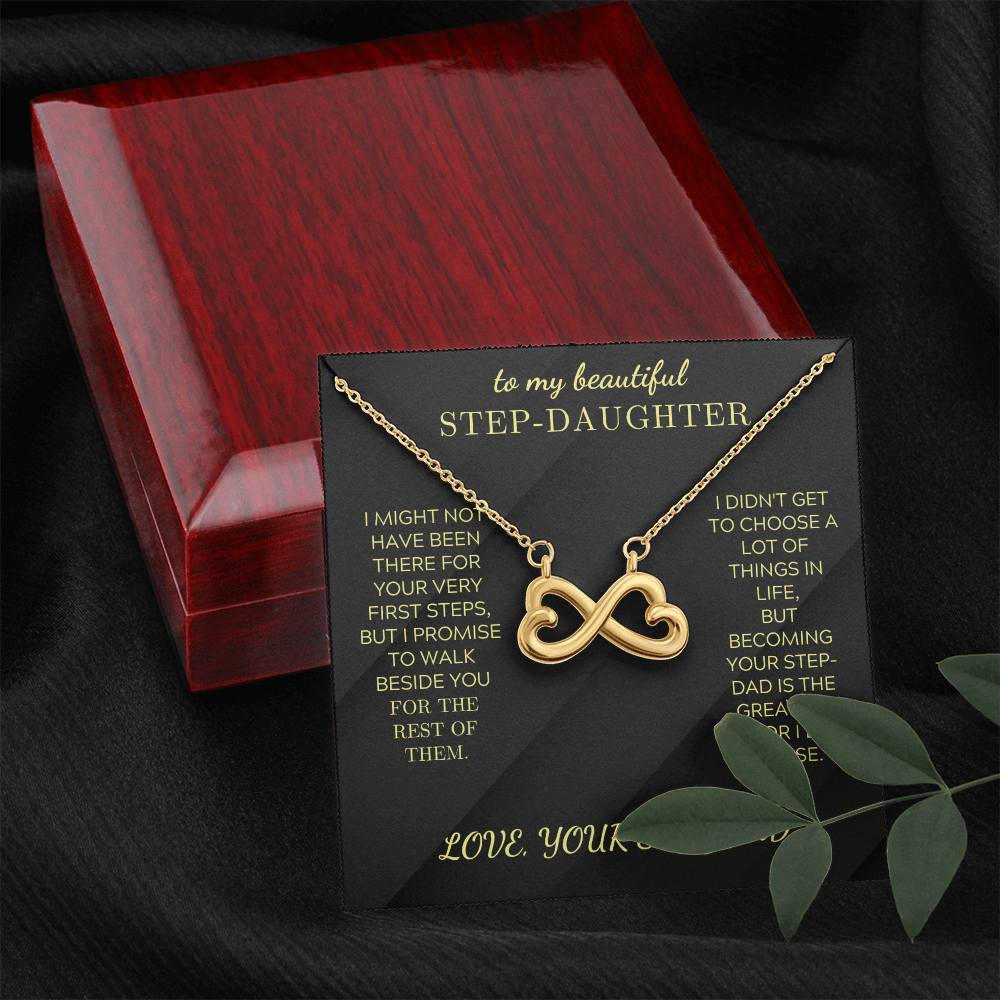 Gold heart-infinity pendant necklace on black insert inside red gift box