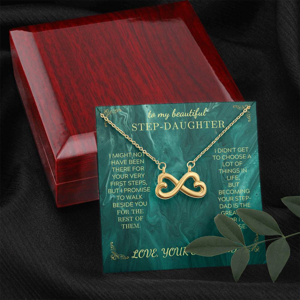 Gold heart infinity pendant necklace on green message card inside a red gift box