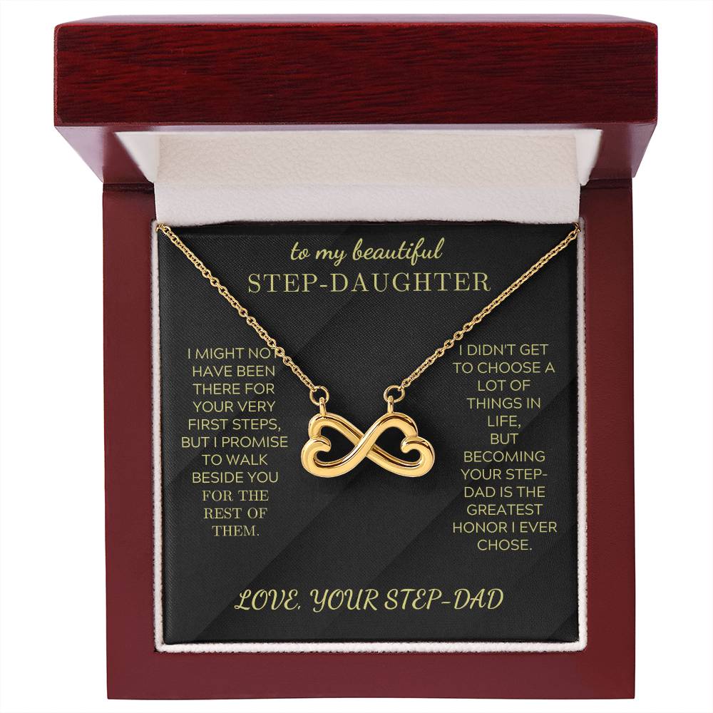 Gold infinity heart pendant necklace on black velvet card in red gift box