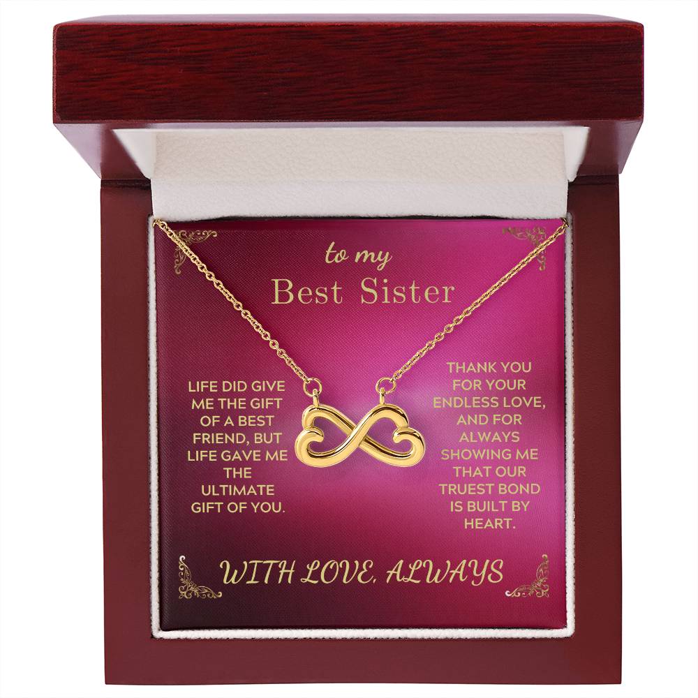 Gold-tone infinity heart pendant necklace in open gift box with chain