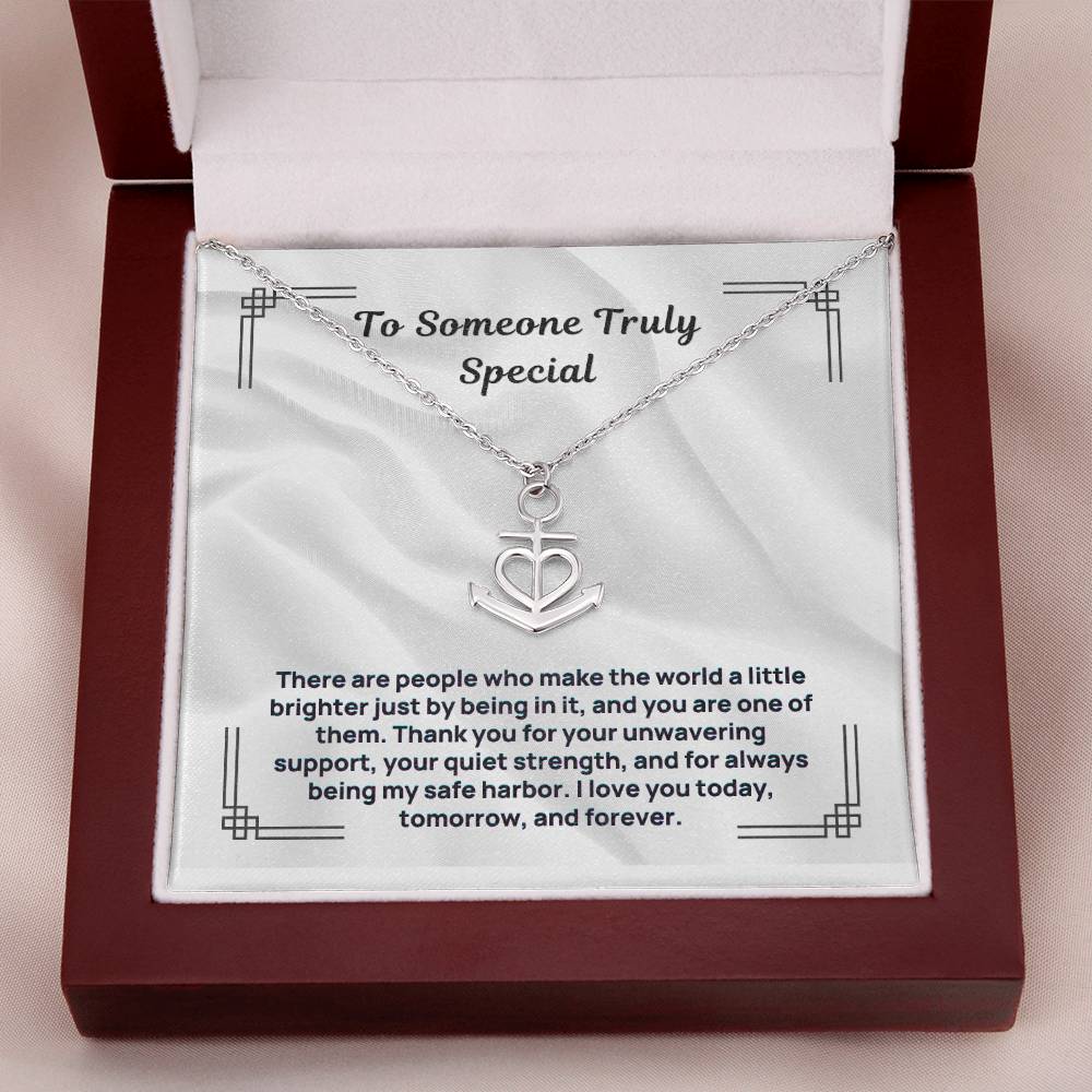 Silver-tone anchor heart pendant necklace on white display card in box