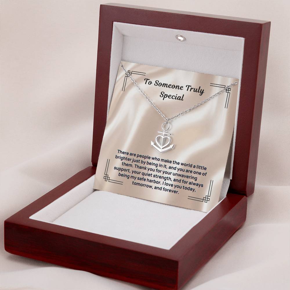 Anchor heart necklace in an open gift box, with chain and pendant visible